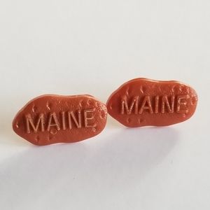 Two vintage Maine potato pins orange plastic tiny lapel brooch vegetable